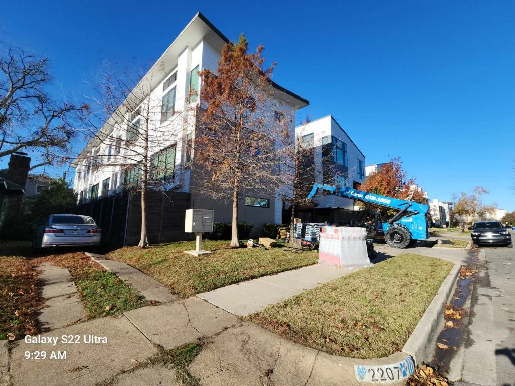 roofing work on apartment building flat roof